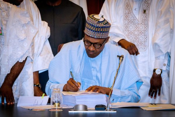 0_1529577064386_Buhari signs National Assembly mutilated budget.jpg